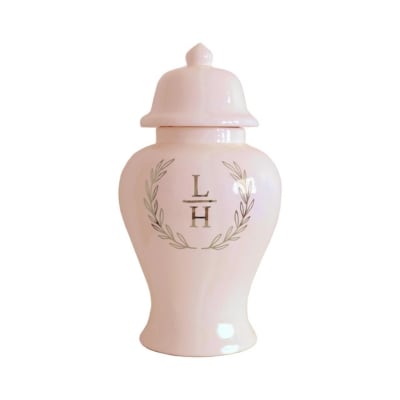         Description: A pink urn with a monogram on it, perfect for Christmas decorations.