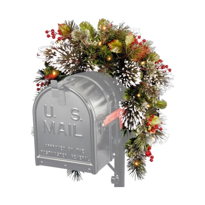 A festive mailbox adorned with holly and pine cones, showcasing delightful Christmas mailbox decorations.