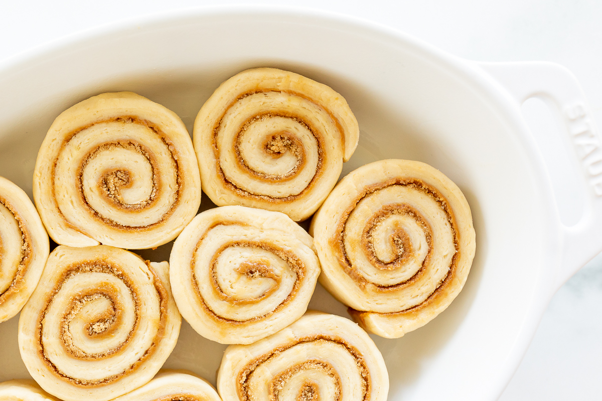 Cookie Butter Cinnamon Rolls in a white dish.