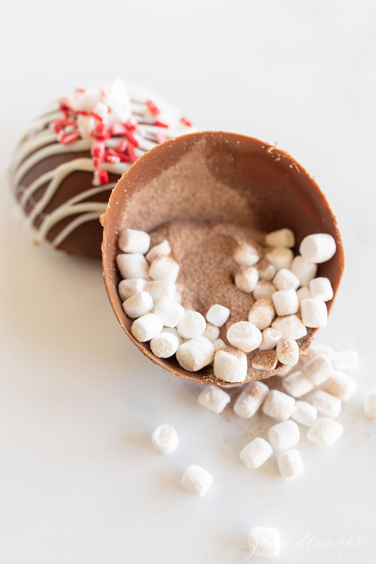 A hot chocolate bomb, a chocolate egg filled with marshmallows and chocolate.