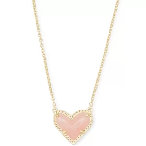 A pink heart necklace on a gold chain, perfect for black Friday.