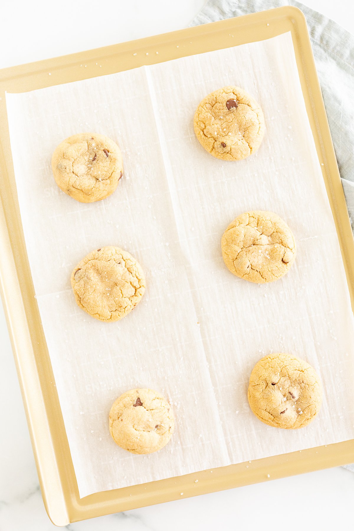 Kitchen gifts of delicious chocolate chip cookies on a baking sheet.
