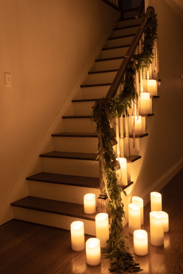 A staircase with flameless candles on it.