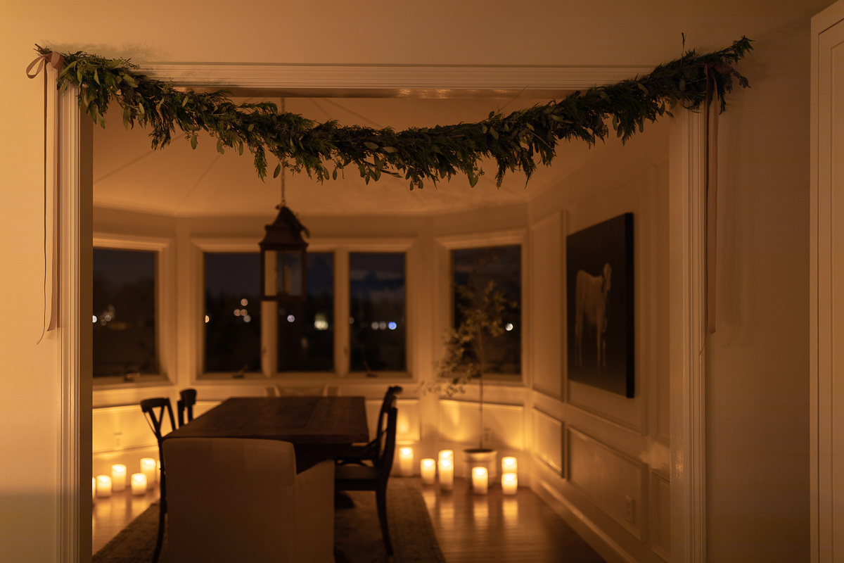 A dining room with LED candles for Christmas decorations.