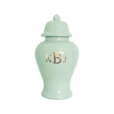 A green urn with a monogram on it.