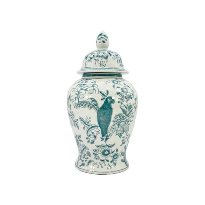 A blue and white jar with a bird on it.