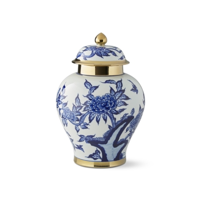 A blue and white ginger jar with a gold lid.