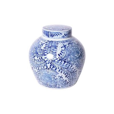 A blue and white jar with a floral design.