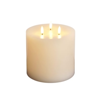 An elegant white candle on a white background, offering a serene ambiance without the need for flames.