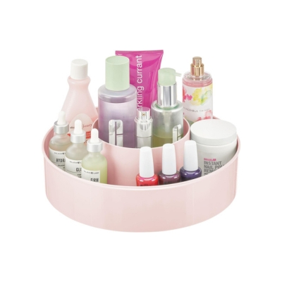 A pink tray serving as a storage container for cosmetics.