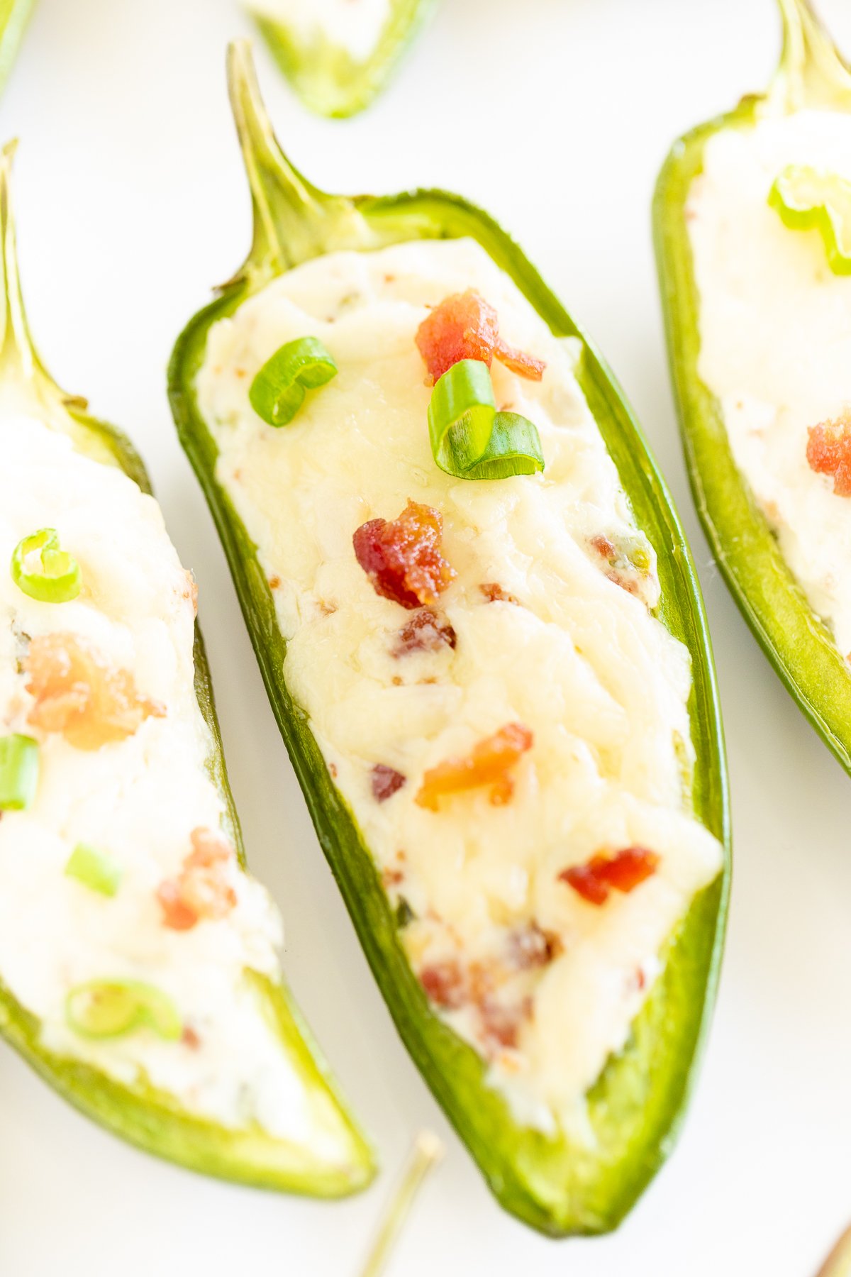 Stuffed jalapenos with cheese and green onions.