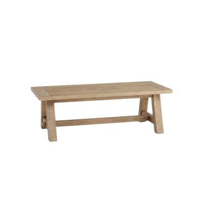 A wooden coffee table with a Pottery Barn look for less on a white background.