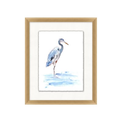 A framed watercolor painting of a heron standing in a body of water, capturing that Pottery Barn look for less. The frame is light wood.