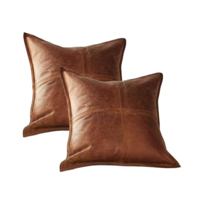 Two brown leather pillows, inspired by the Pottery Barn look for less, on a white background.