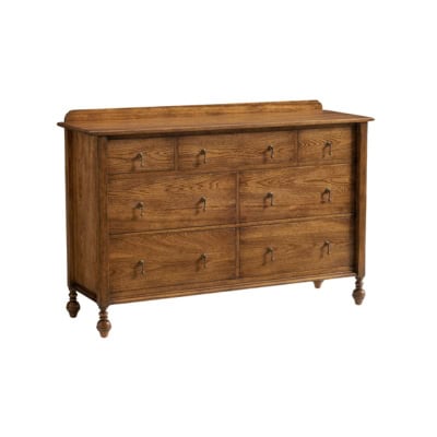 A wooden dresser with eight drawers, including three small top drawers and five larger ones below, all featuring metal handles. The dresser has turned legs and a raised back edge, offering a Pottery Barn look for less.