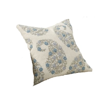 An affordable pillow with blue and white flowers on it, inspired by the Pottery Barn look.