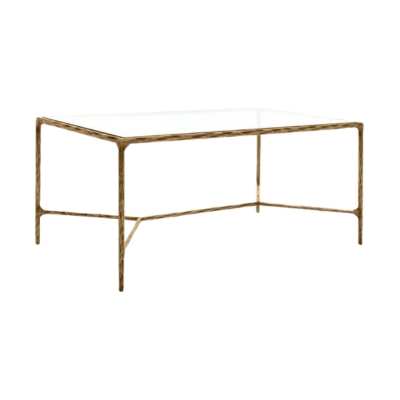 A gold and glass coffee table with a glass top, inspired by the RH Look for Less.