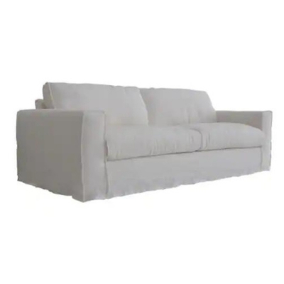 A RH Look for Less: A white couch on a white background.