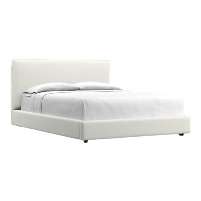A white bed with a white headboard and footboard, offering the RH look for less.