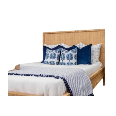 Serena and Lily-inspired bed with blue pillows and a wooden frame.