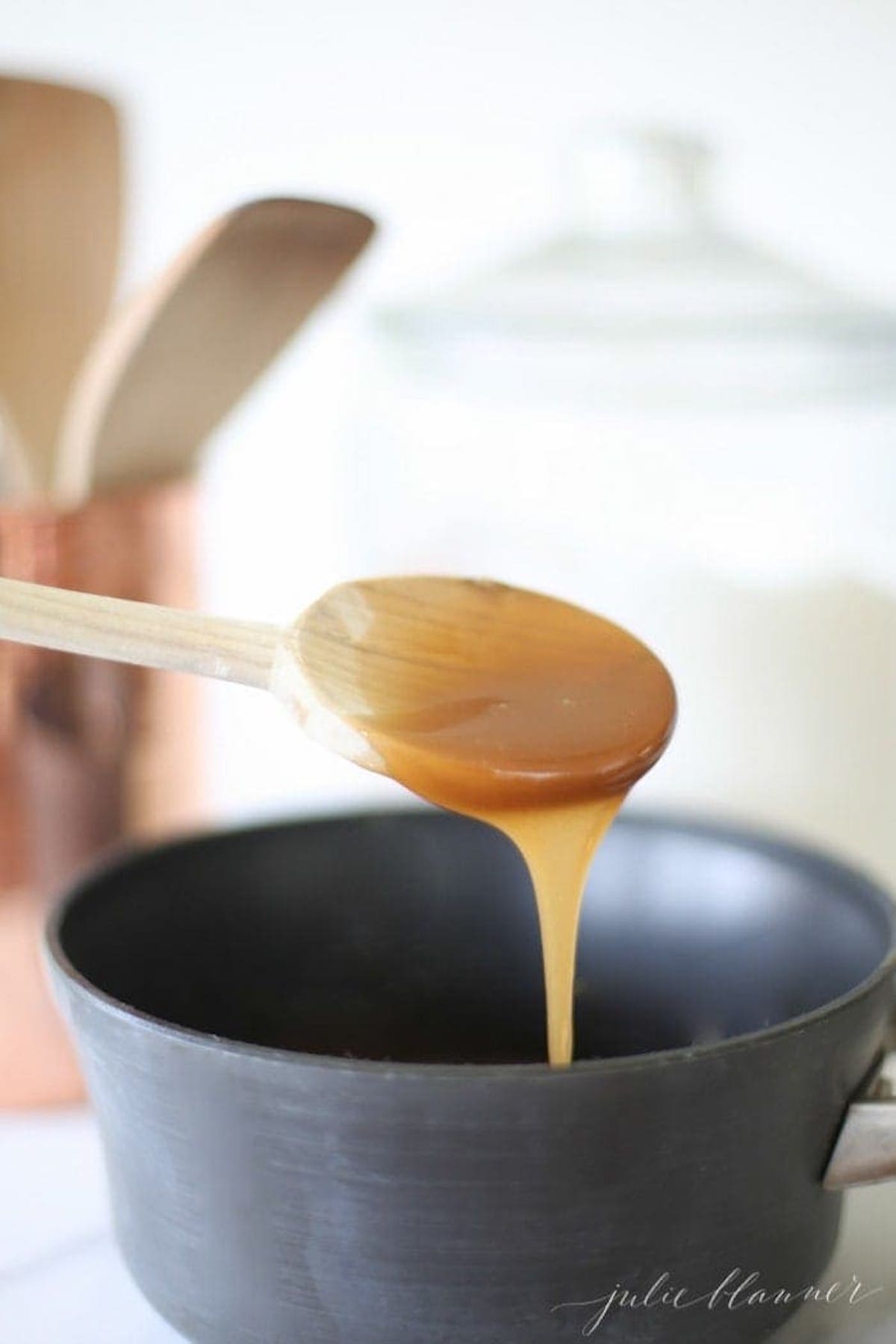 Salted caramel sauce being poured into a pan.