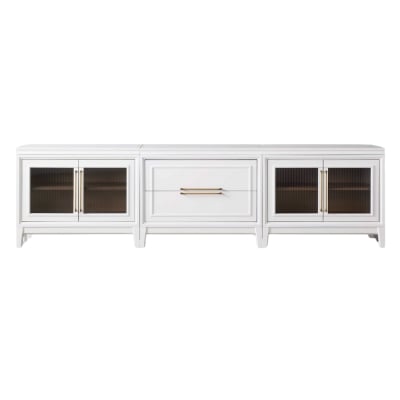A white TV stand with glass doors and drawers, offering an Arhaus look for less.