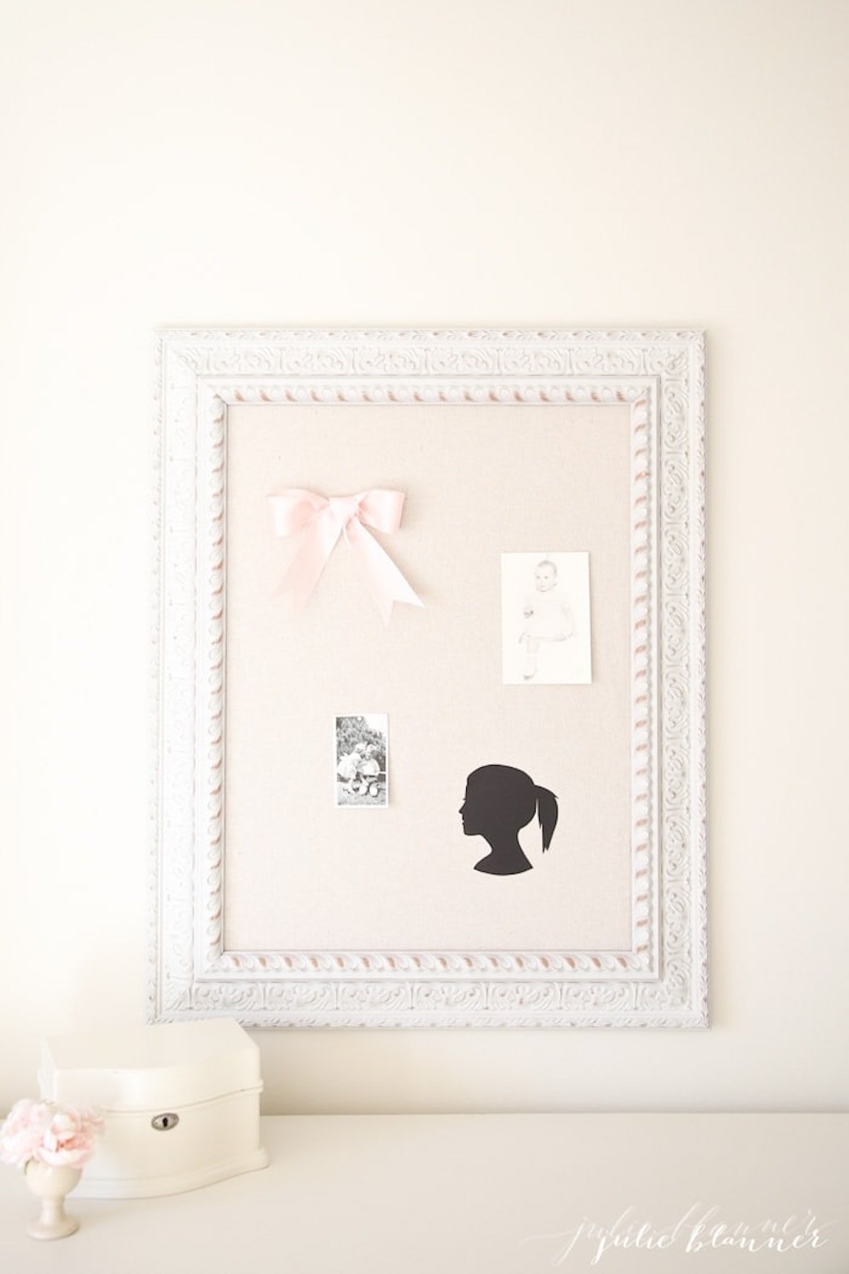 An enchanting DIY wall decor featuring a picture of a girl within a white frame.