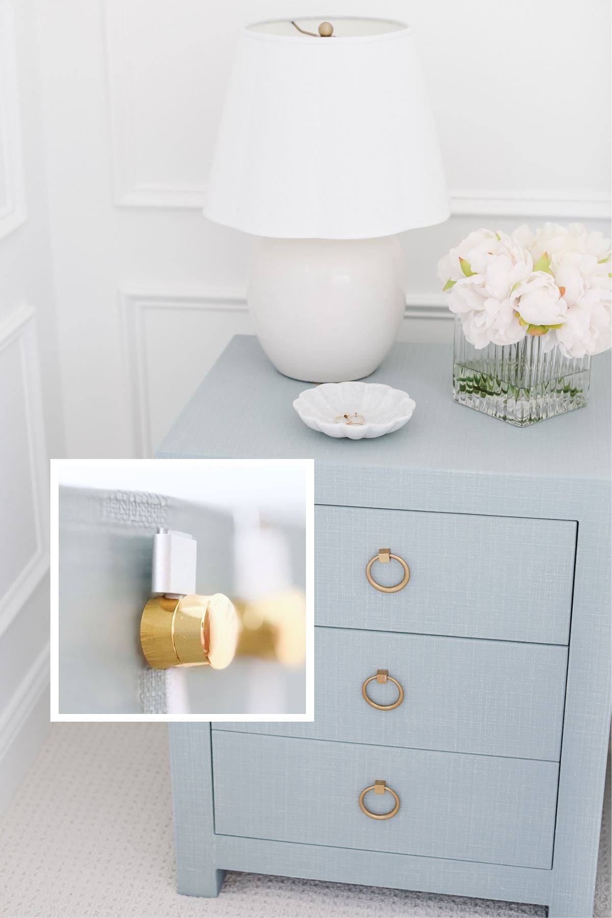 A light blue nightstand with gold ring drawer pulls, a white lamp, a glass vase with white flowers, and a white dish—perfect for displaying your favorite Amazon gadgets. Inset shows a close-up of a gold drawer pull.