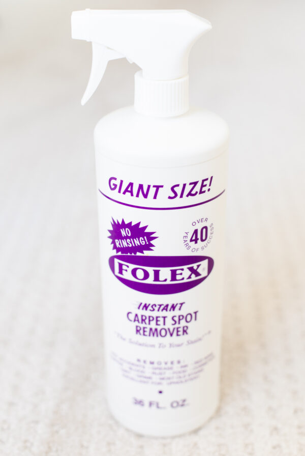 A bottle of Folex carpet cleaner on a white surface.
