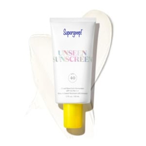 A tube of Supergoop! Unseen Sunscreen SPF 40 with a yellow cap, perfect as a chic addition to your Easter basket fillers, placed on a light background.