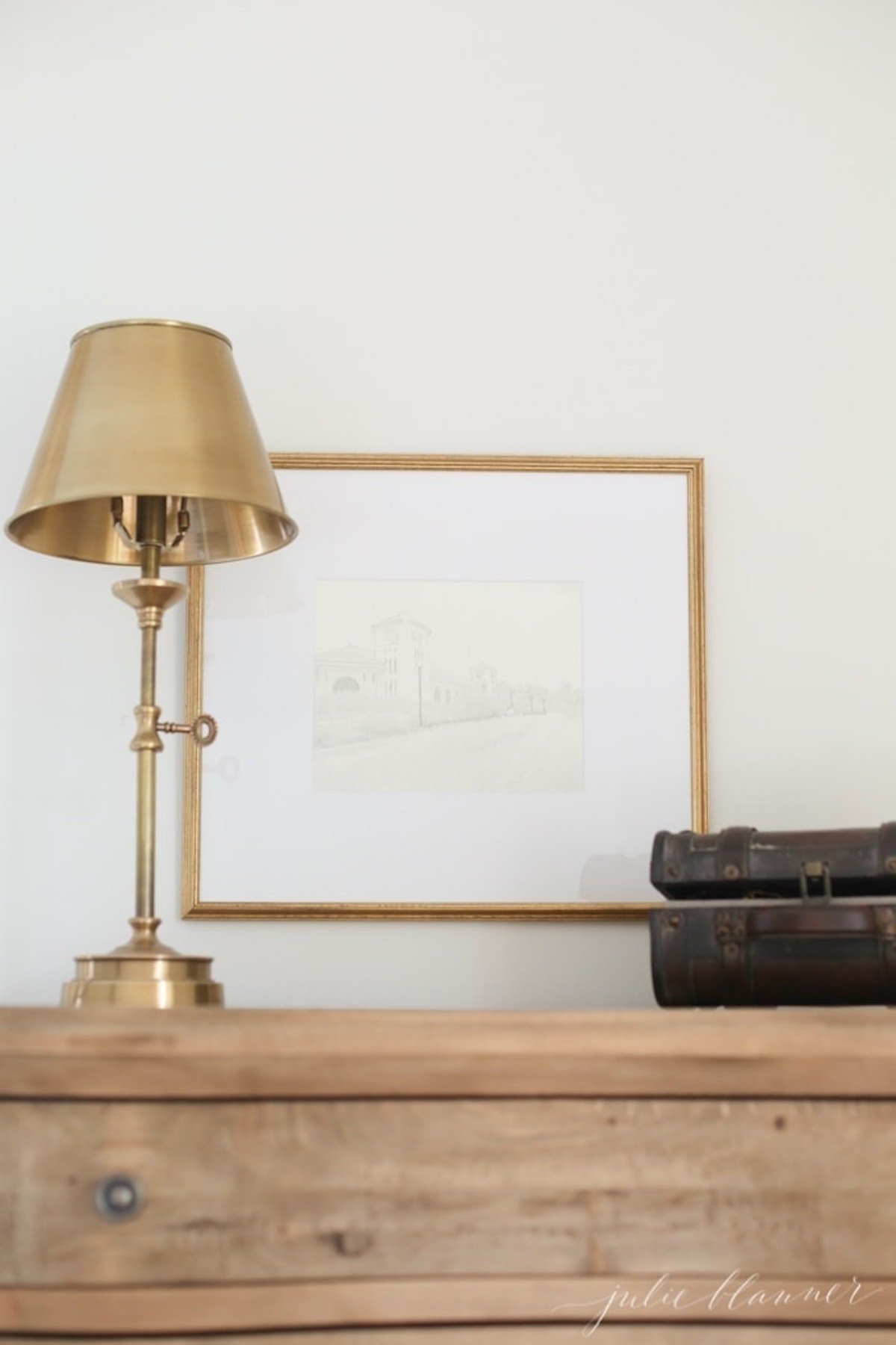 A DIY brass lamp adorning a dresser.