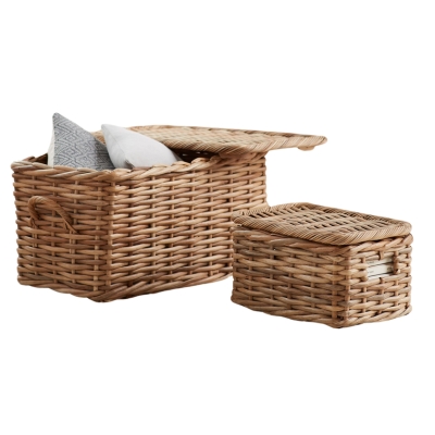 Two wicker storage baskets on a white background, perfect for music room ideas.