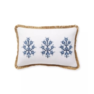 Elevate your music room with this stylish blue and white pillow featuring tassels and fringes.