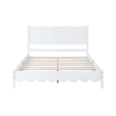 A white, wooden bed frame with a scalloped edge design and slatted base, offering a Pottery Barn Kids look for less.