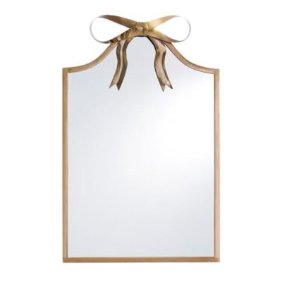 A gold mirror with a bow on it.