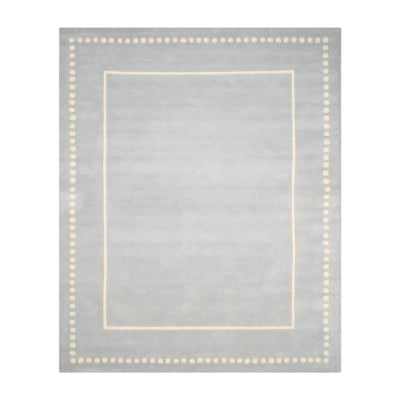 A gray rug with a white border, inspired by Pottery Barn Kids.