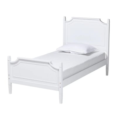 A white wooden bed with a pillow on top.