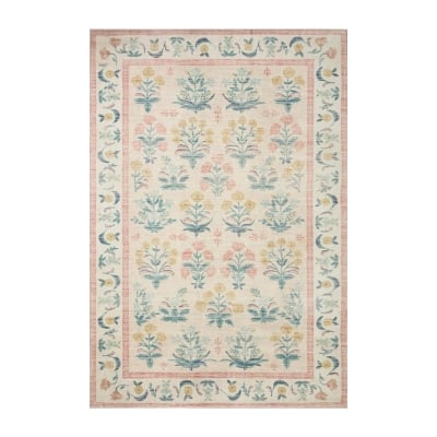 A pink and blue rug with floral designs.