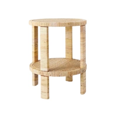 A round rattan side table reminiscent of Serena and Lily dupes on a white background.