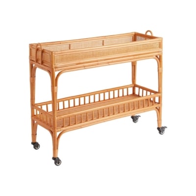 A rattan serving cart on wheels, similar to Serena and Lily dupes.