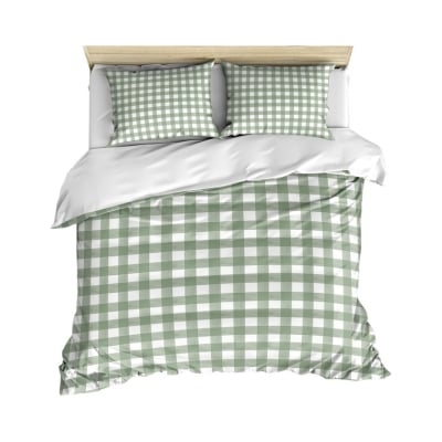 A green and white plaid duvet cover on a bed, similar to Serena and Lily dupes.
