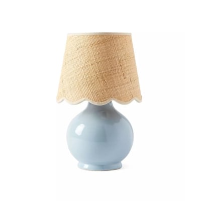 A blue table lamp with a rattan shade, perfect for serena and lily dupes enthusiasts.