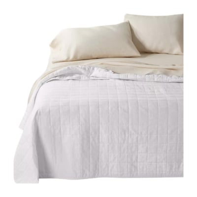 Get the Serena and Lily look for less with this bed featuring a white quilt and pillows.