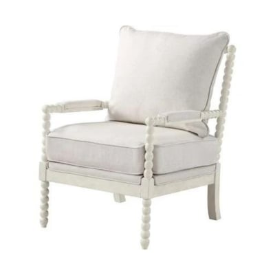 A white chair with a cushion in a Serena and Lily look for less style.