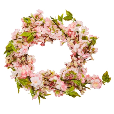 A pink spring wreath on a white background.