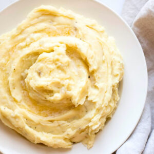 caramelized onion mashed potatoes in a white bowl