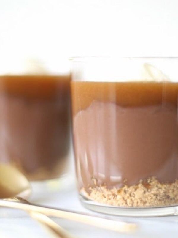 Two small cups full of homemade chocolate pudding