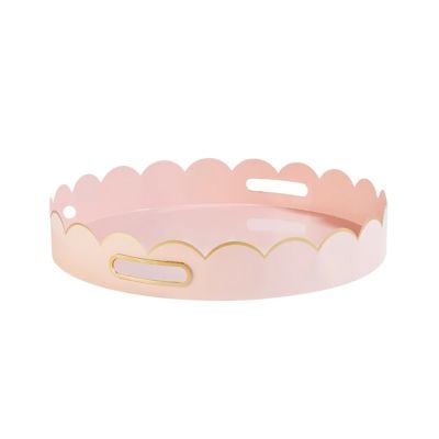 A round, light pink tray with scalloped edges, gold detailing, and two oval cutout handles—perfect for adding scalloped decor charm to any space.