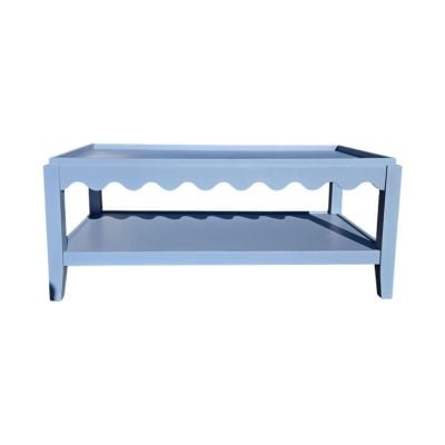 Light blue rectangular coffee table with scalloped trim, open lower shelf, and four legs—an ideal accent for lovers of scalloped decor.