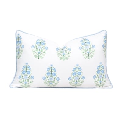 An affordable white pillow with serene blue flowers, perfect for achieving a Serena and Lily look for less.